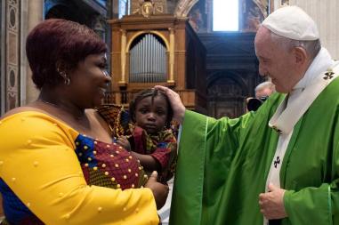 Pope Francis blesses a child after Celebrating Mass for Migrants in St. Peter's Basilica, Rome 08/07/19 © Vatican Media